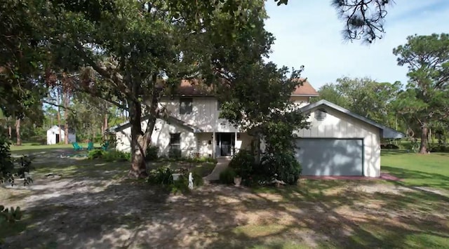 view of front facade featuring a front lawn and a garage