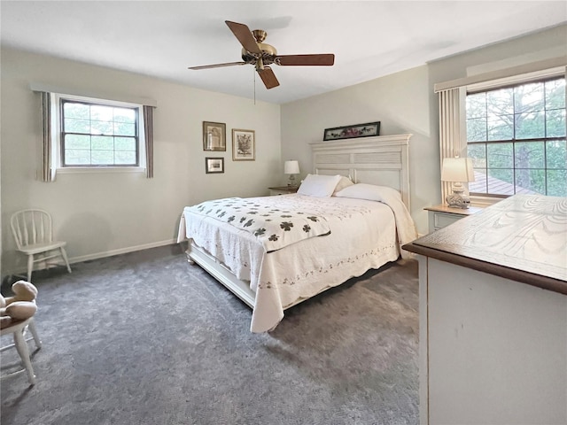 bedroom with dark colored carpet and ceiling fan