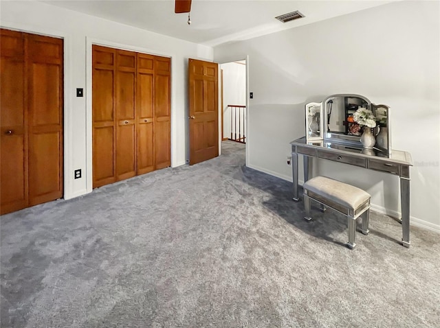 office area with carpet and ceiling fan