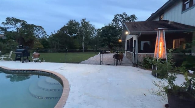 view of swimming pool featuring grilling area