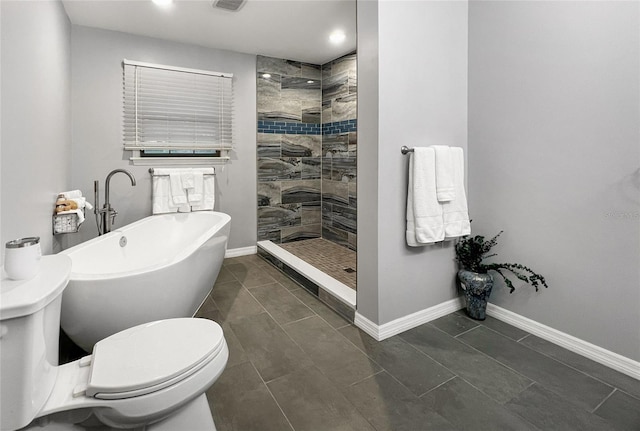 bathroom featuring toilet and shower with separate bathtub