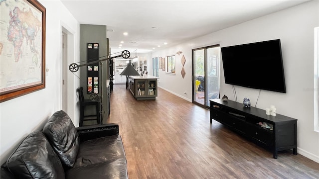 6885 Orchid Tree Dr, Grant, FL 32949 - living area featuring wood finished floors, baseboards, and recessed lighting