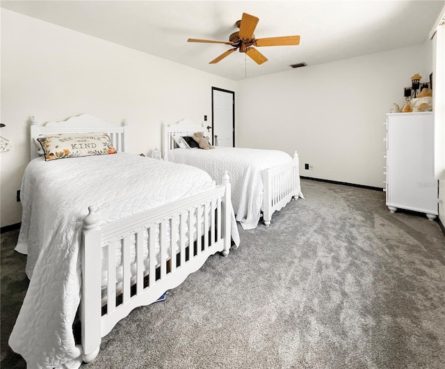 6885 Orchid Tree Dr, Grant, FL 32949 - carpeted bedroom with a ceiling fan
