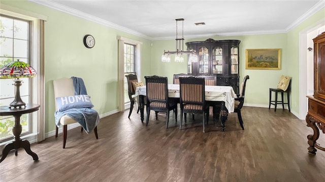 6885 Orchid Tree Dr, Grant, FL 32949 - dining area with dark wood finished floors, ornamental molding, and baseboards