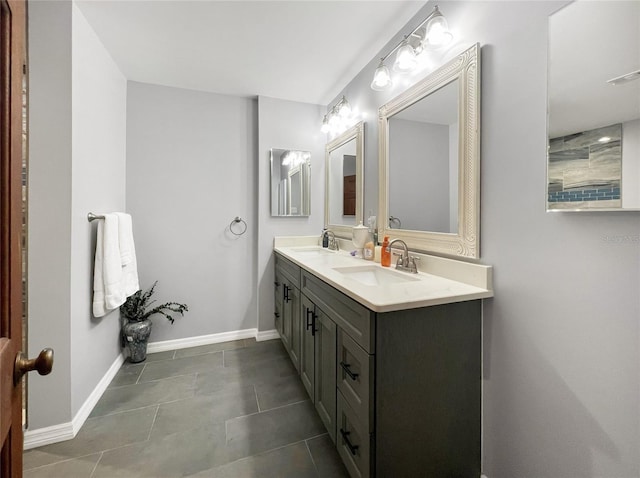 6885 Orchid Tree Dr, Grant, FL 32949 - full bathroom with double vanity, tile patterned flooring, and baseboards