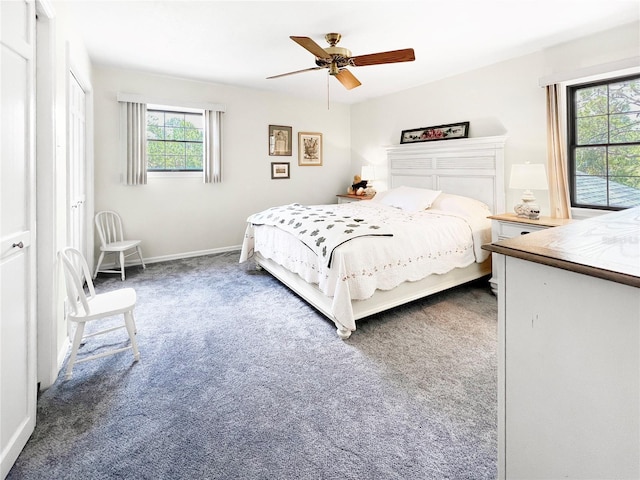6885 Orchid Tree Dr, Grant, FL 32949 - bedroom with carpet flooring, ceiling fan, and baseboards