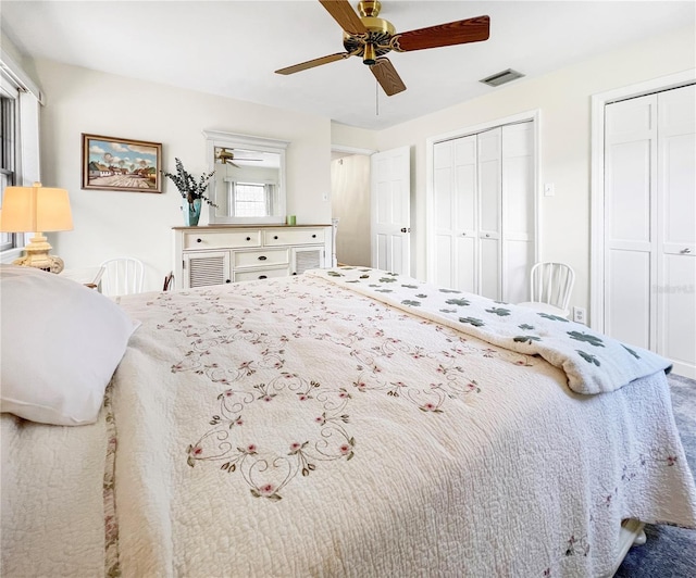 6885 Orchid Tree Dr, Grant, FL 32949 - bedroom with two closets and a ceiling fan