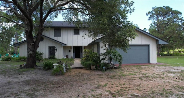 6885 Orchid Tree Dr, Grant, FL 32949 - view of front of house featuring dirt driveway and a garage
