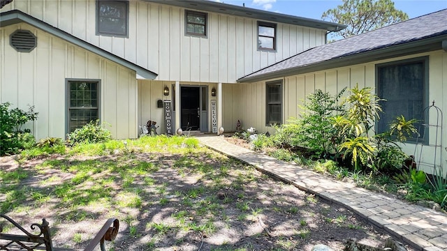6885 Orchid Tree Dr, Grant, FL 32949 - view of exterior entry featuring a shingled roof