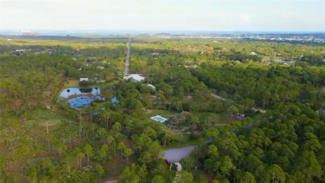 6885 Orchid Tree Dr, Grant, FL 32949 - aerial view of property's location featuring a heavily wooded area and a nearby body of water