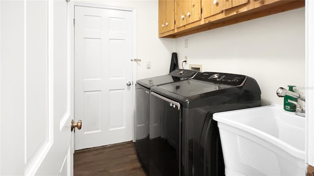 6885 Orchid Tree Dr, Grant, FL 32949 - laundry area with separate washer and dryer, dark wood-type flooring, and cabinet space