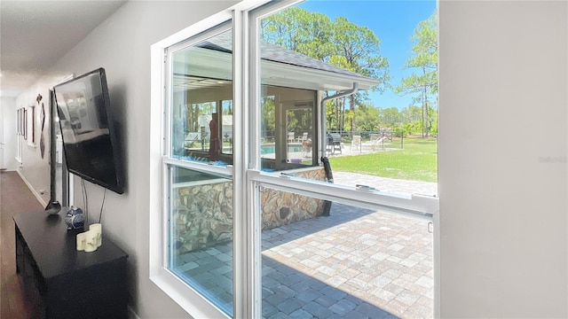 6885 Orchid Tree Dr, Grant, FL 32949 - doorway to outside with brick patterned flooring