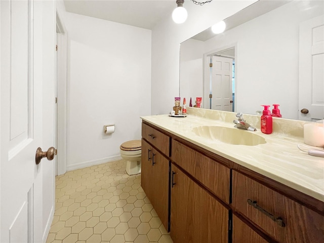 6885 Orchid Tree Dr, Grant, FL 32949 - bathroom featuring vanity, toilet, baseboards, and tile patterned flooring