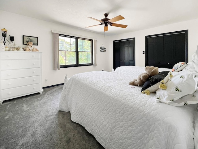 6885 Orchid Tree Dr, Grant, FL 32949 - carpeted bedroom featuring baseboards, two closets, and ceiling fan