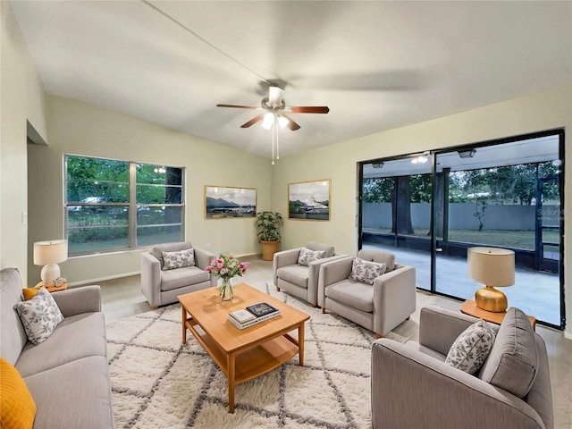 living room featuring ceiling fan and vaulted ceiling