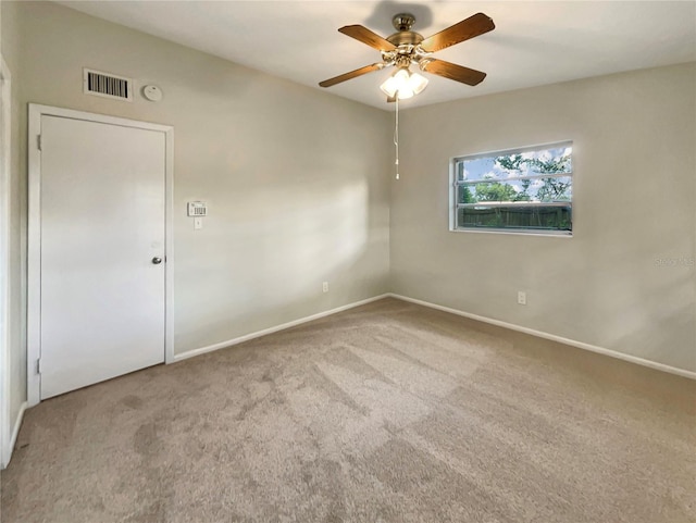 unfurnished room featuring ceiling fan and light colored carpet