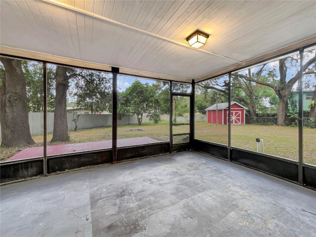 unfurnished sunroom featuring wood ceiling