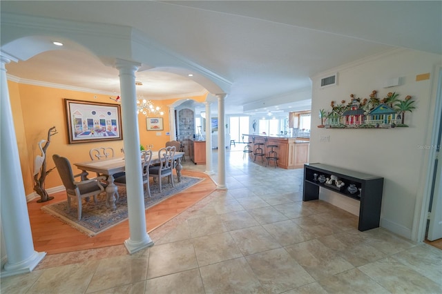 dining area with a notable chandelier and crown molding