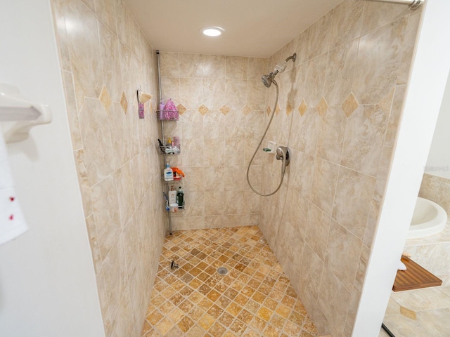 bathroom with tiled shower