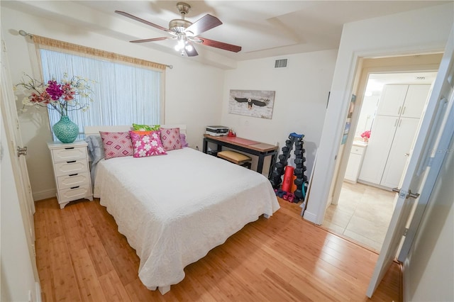 bedroom featuring ceiling fan and light hardwood / wood-style flooring