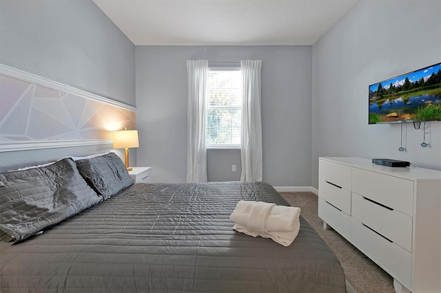 bedroom with dark carpet