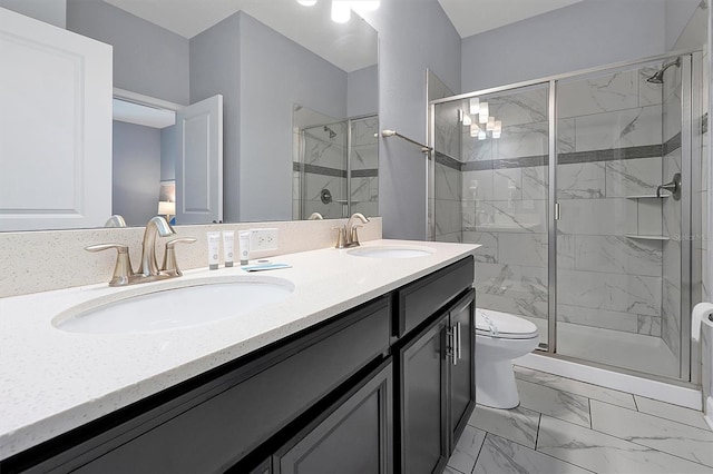 bathroom with vanity, an enclosed shower, and toilet