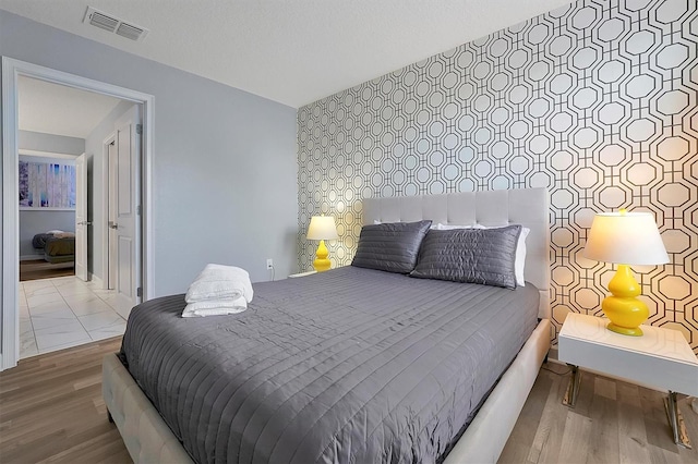 bedroom featuring hardwood / wood-style floors