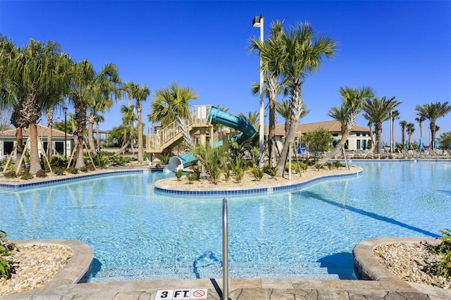 view of pool featuring a water slide