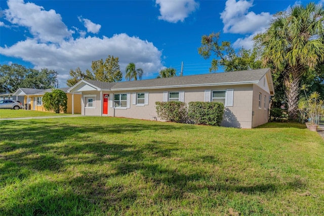 single story home featuring a front yard