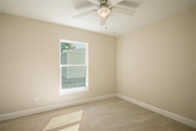 unfurnished room with ceiling fan