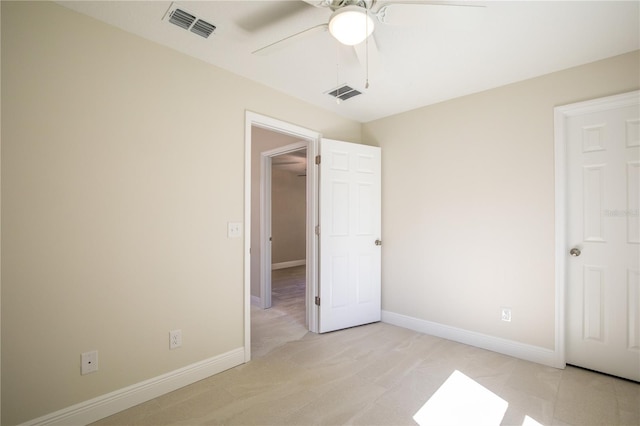 unfurnished bedroom with ceiling fan and light carpet