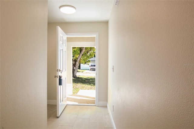 entryway featuring light tile patterned floors