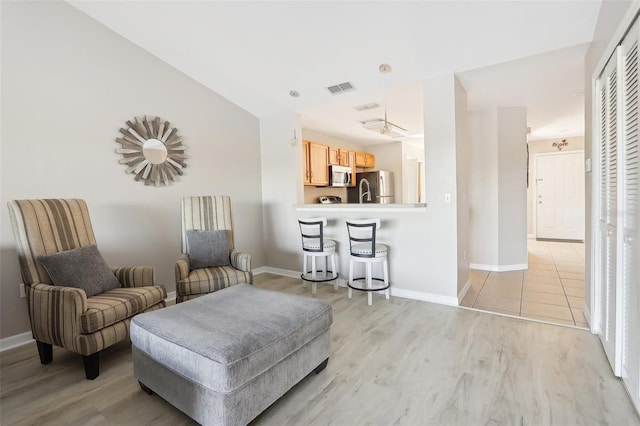 sitting room with light wood-type flooring