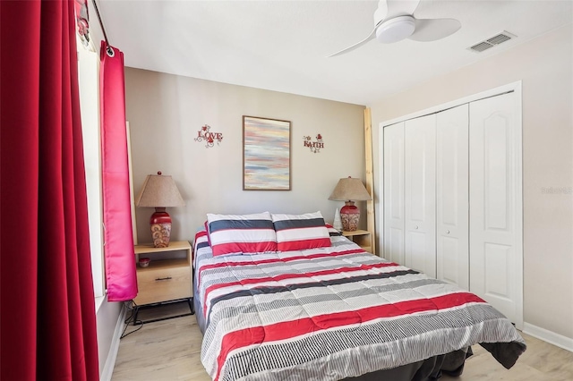 bedroom with a closet, ceiling fan, and light hardwood / wood-style floors