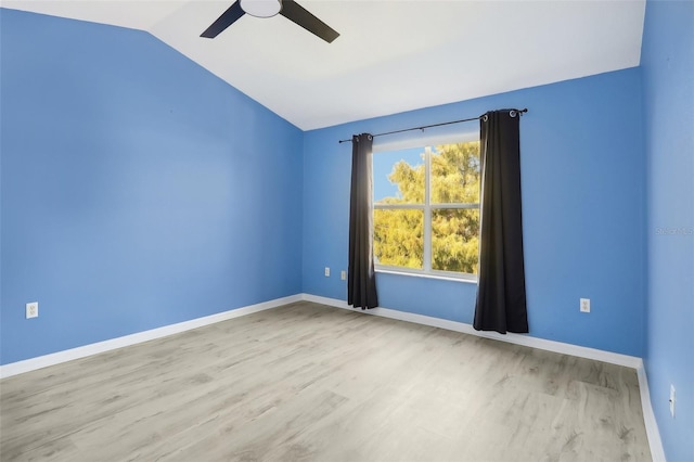 unfurnished room featuring ceiling fan, light hardwood / wood-style flooring, and vaulted ceiling