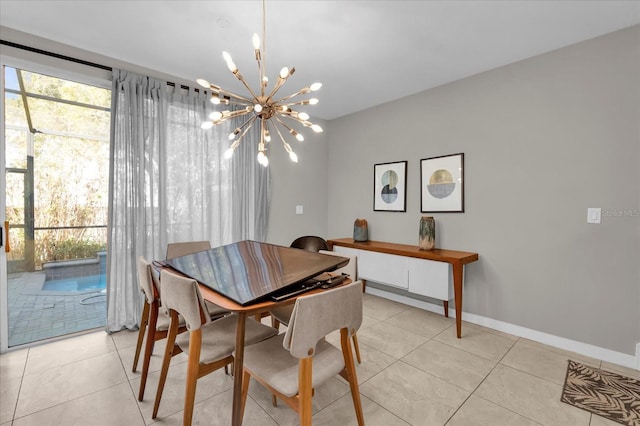 dining room featuring light tile patterned floors, baseboards, and a chandelier