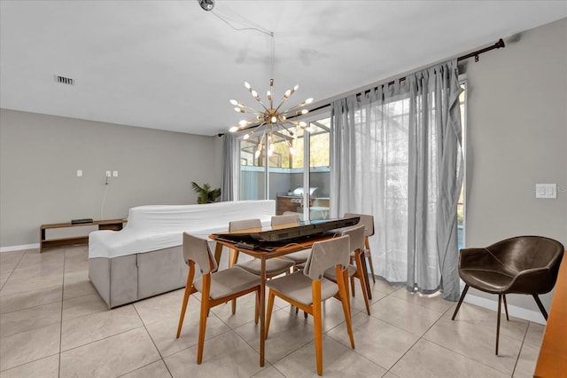 dining space with a chandelier, visible vents, baseboards, and light tile patterned floors