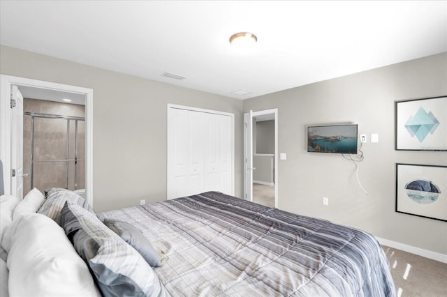 bedroom featuring carpet floors, a closet, visible vents, and baseboards