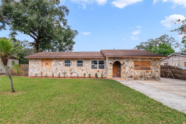 ranch-style house with a front lawn