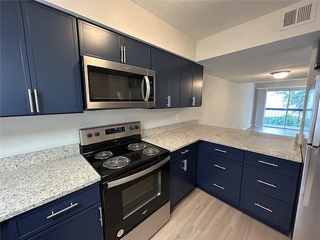 kitchen with kitchen peninsula, appliances with stainless steel finishes, light wood-type flooring, and blue cabinets