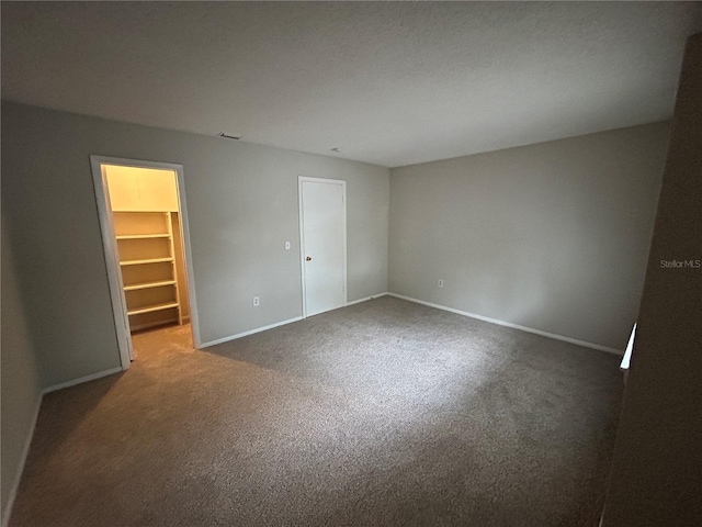 unfurnished room featuring carpet floors