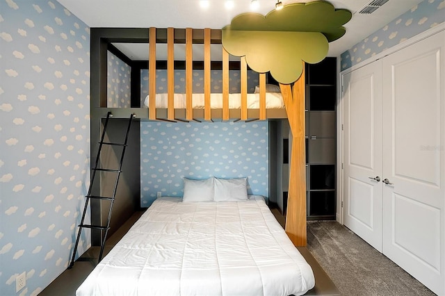 carpeted bedroom featuring a closet