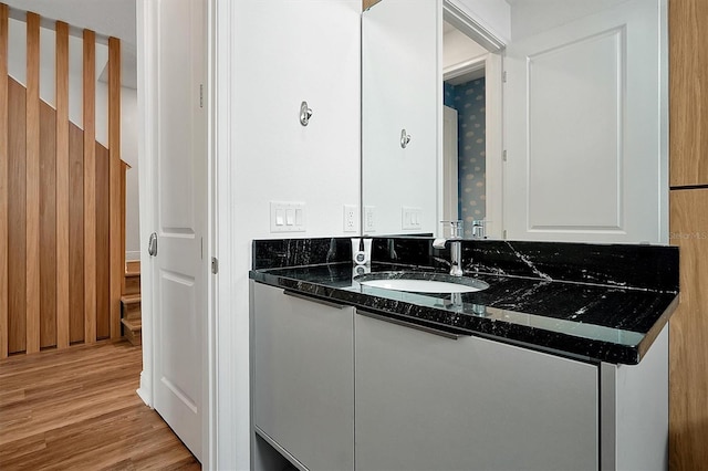 bathroom featuring hardwood / wood-style floors and vanity