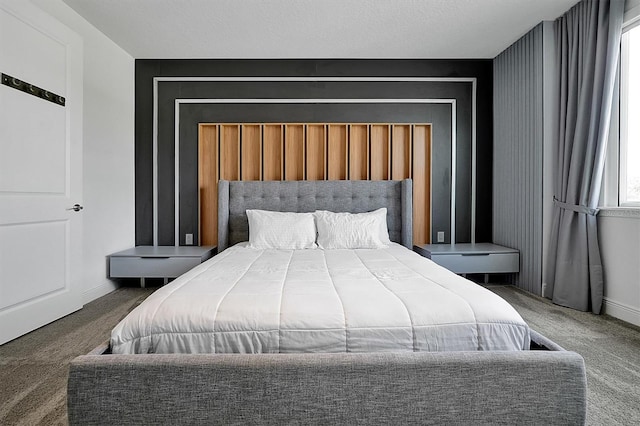 carpeted bedroom with a textured ceiling