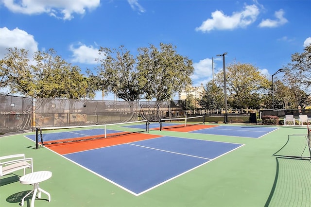 view of sport court with basketball hoop