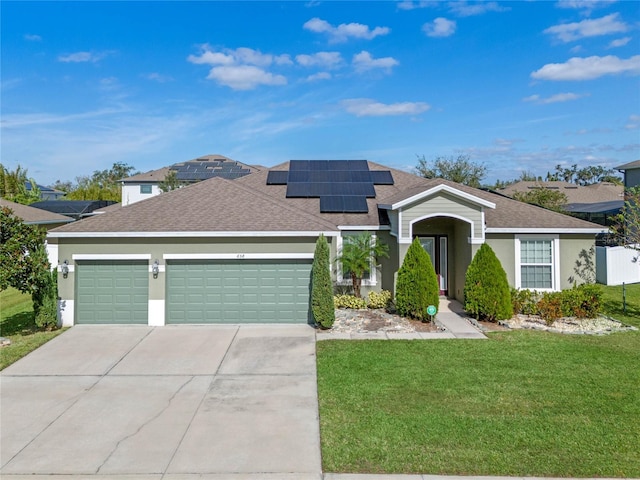 view of front facade featuring solar panels, a garage, and a front lawn