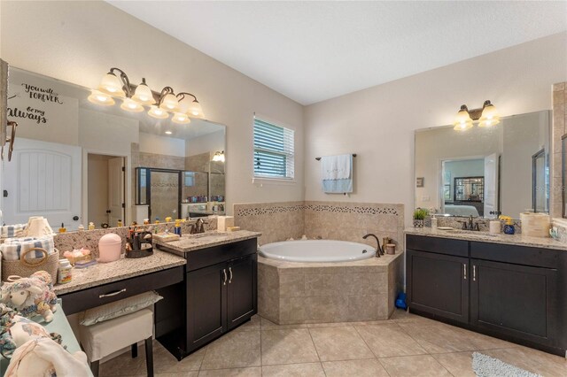 bathroom with vanity, tile patterned flooring, and plus walk in shower