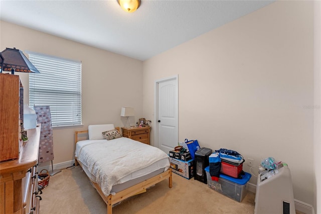 bedroom featuring light carpet