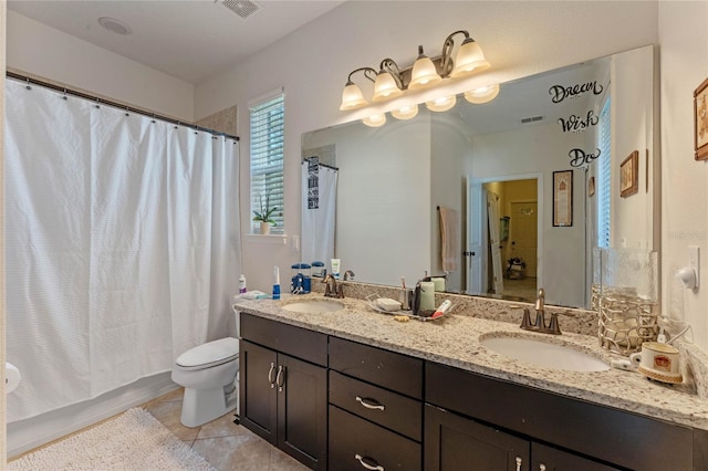 full bathroom featuring tile patterned flooring, vanity, toilet, and shower / bath combo