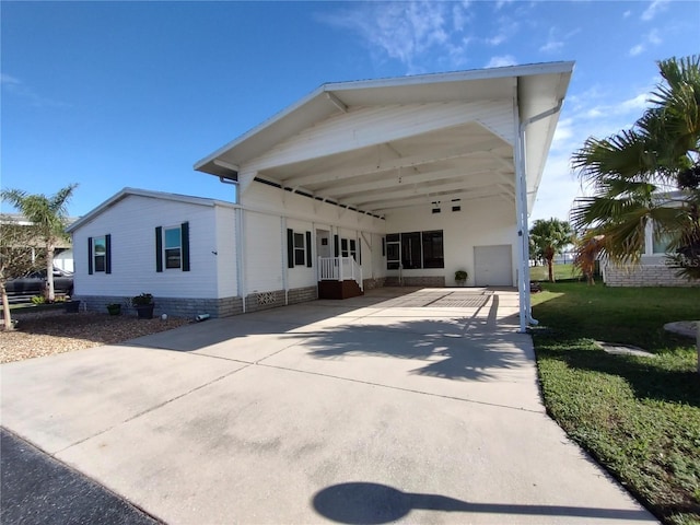 back of house with a carport